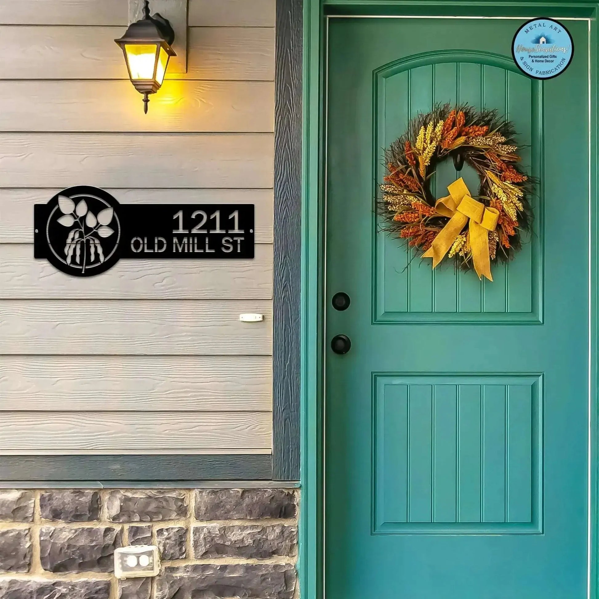 Black Bean Plant Address Sign featuring a bean plant design on the right and house number '1211 Old Mill St' on the left, mounted on a door wall.