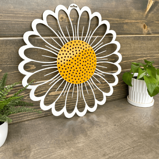 Daisy metal wall art with white petals and yellow center on wood backdrop, rustic farmhouse décor, custom color powder coated metal sign
