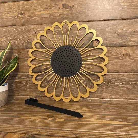 Sunflower metal wreath sample with hook, decorative tabletop display, wooden surface, indoor plant accent, handcrafted floral decor, modern home styling art