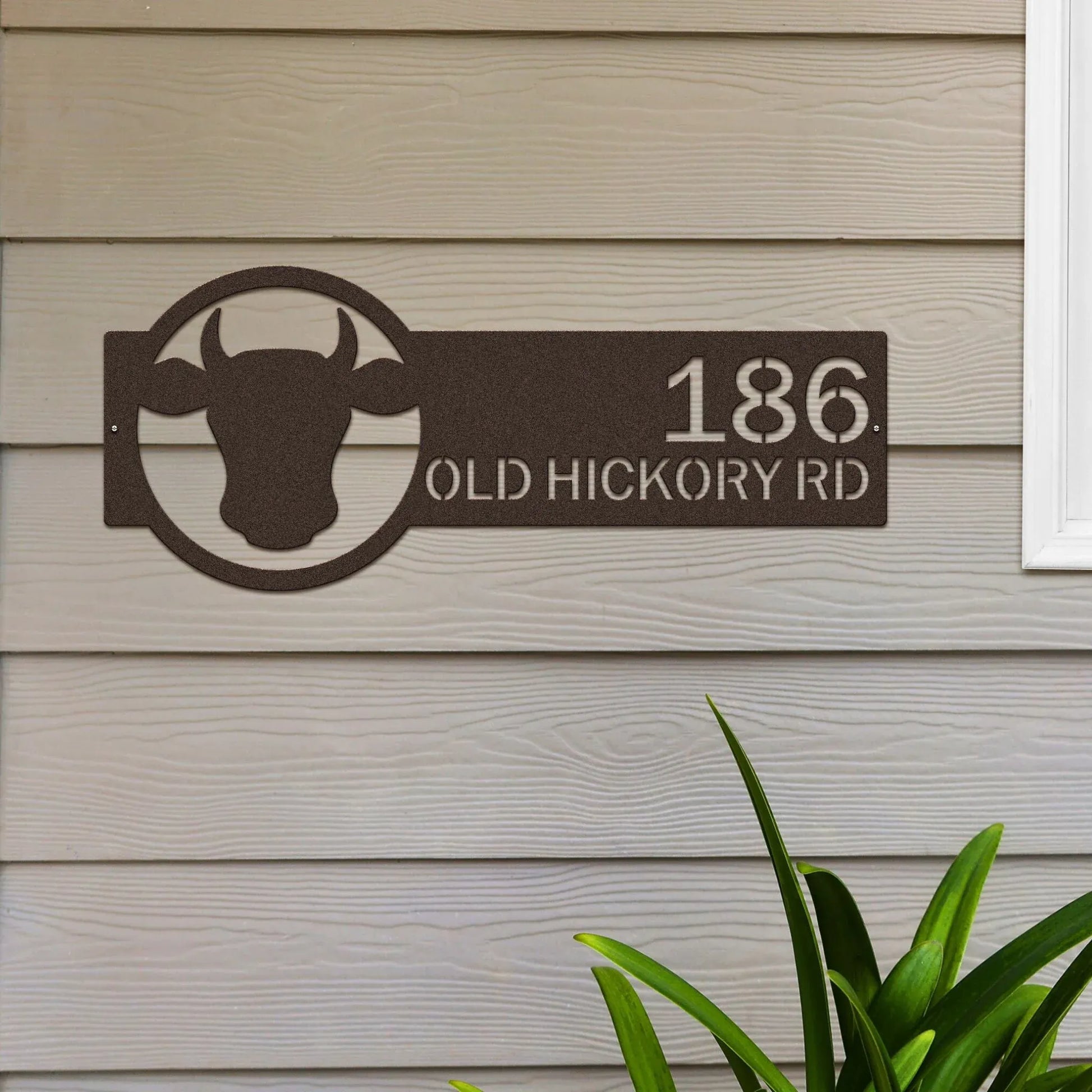 Oil rubbed bronze Cattle Farm Monogram Address Sign featuring a cattle head on the right and house number '186 Old Hickory Rd' on the left.
