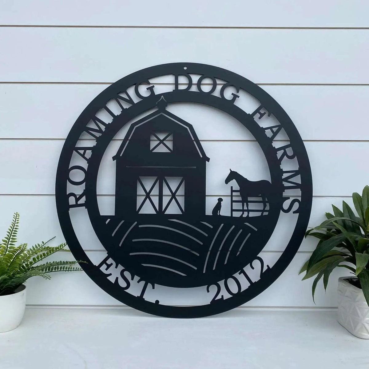 Custom barn dog horse ranch metal sign for farmhouse décor, personalized plaque with “Roaming Dog Farms” on white wooden background.
