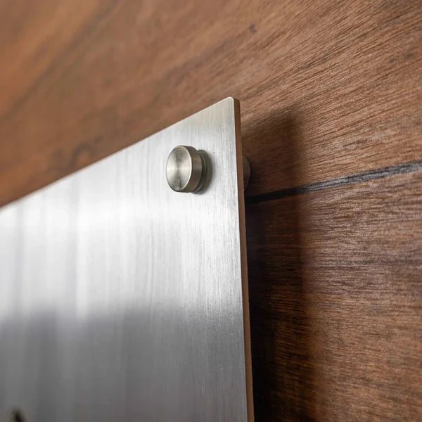 Metal bracket securely attached to a wooden surface, highlighting sturdy construction and functional design.