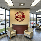 Custom metal business anniversary sign reading “40 Years,” displayed on car dealership interior wall, decorative corporate milestone décor, HouseSensationsArt