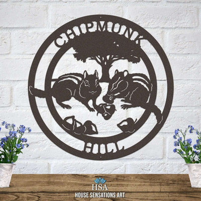 Custom metal Chipmunk Crossing sign, decorative outdoor wall art with "CHIPMUNK" text and chipmunk design, powder coated plaque mounted on white brick wall