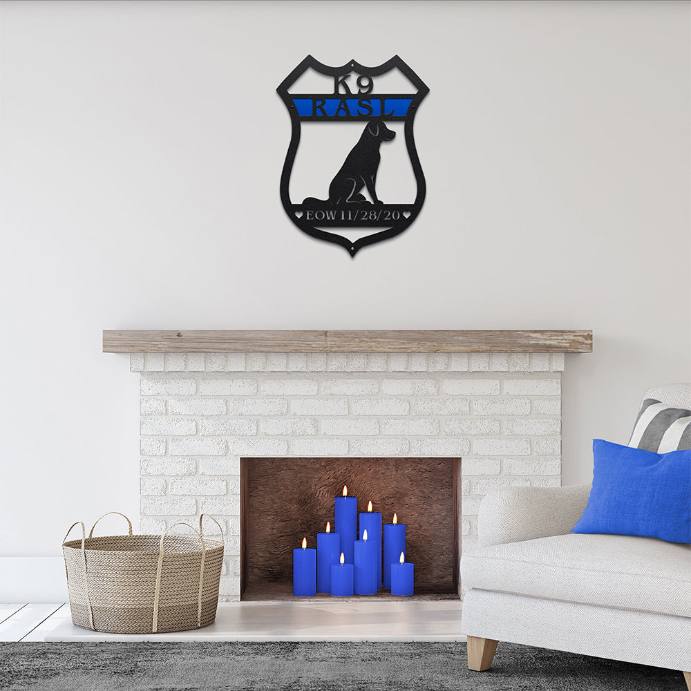 Decorative wall art displayed above a fireplace with blue candles in a living room setting, creating a cozy and stylish focal point.