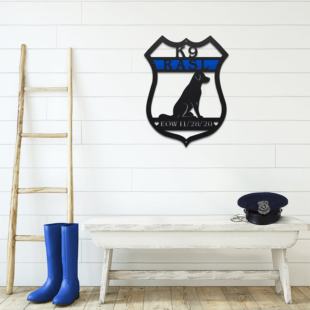 Decorative metal wall art featuring a dog silhouette and text mounted on a white wall, styled above a wooden bench with boots, creating a rustic and inviting décor scene.