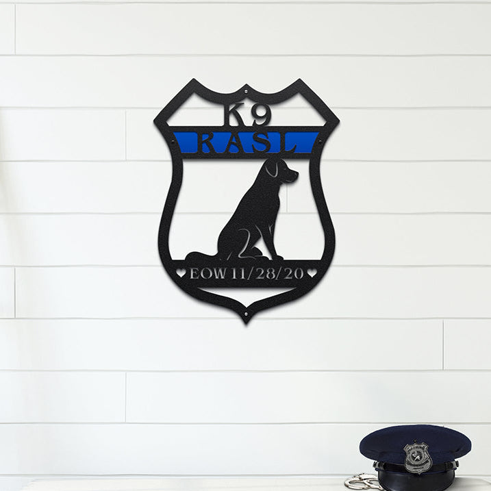 Decorative metal wall art featuring a dog silhouette and text mounted on a white wall, styled above a wooden bench with boots, creating a rustic and inviting décor scene.