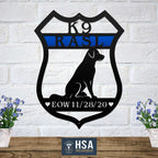 Decorative metal sign featuring a K9 RASL design mounted on a white brick wall, showcasing bold styling and durable metal craftsmanship.