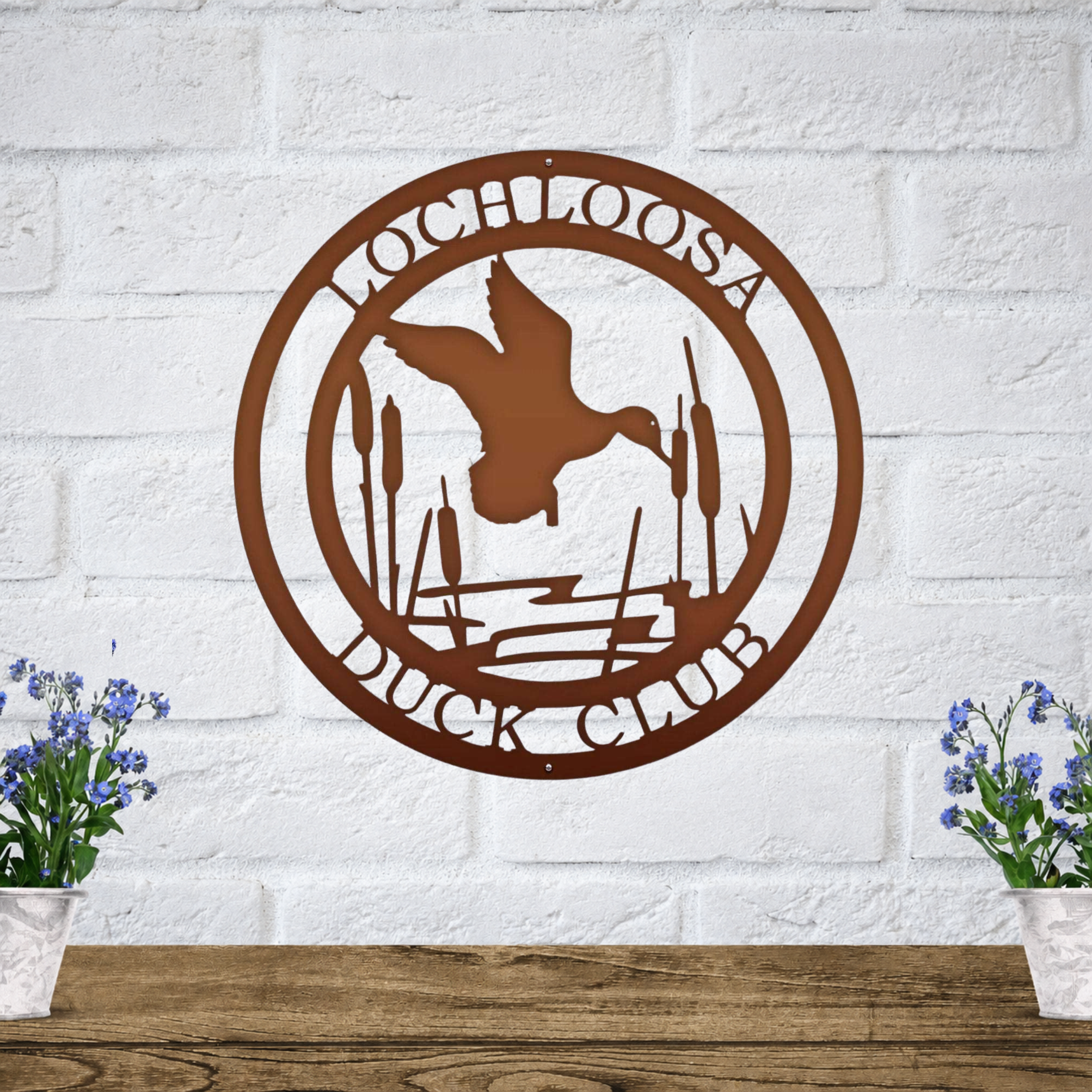 Rustic brown personalized duck club metal sign with flying duck and cattail design for cabin, lodge, or outdoor wall decor