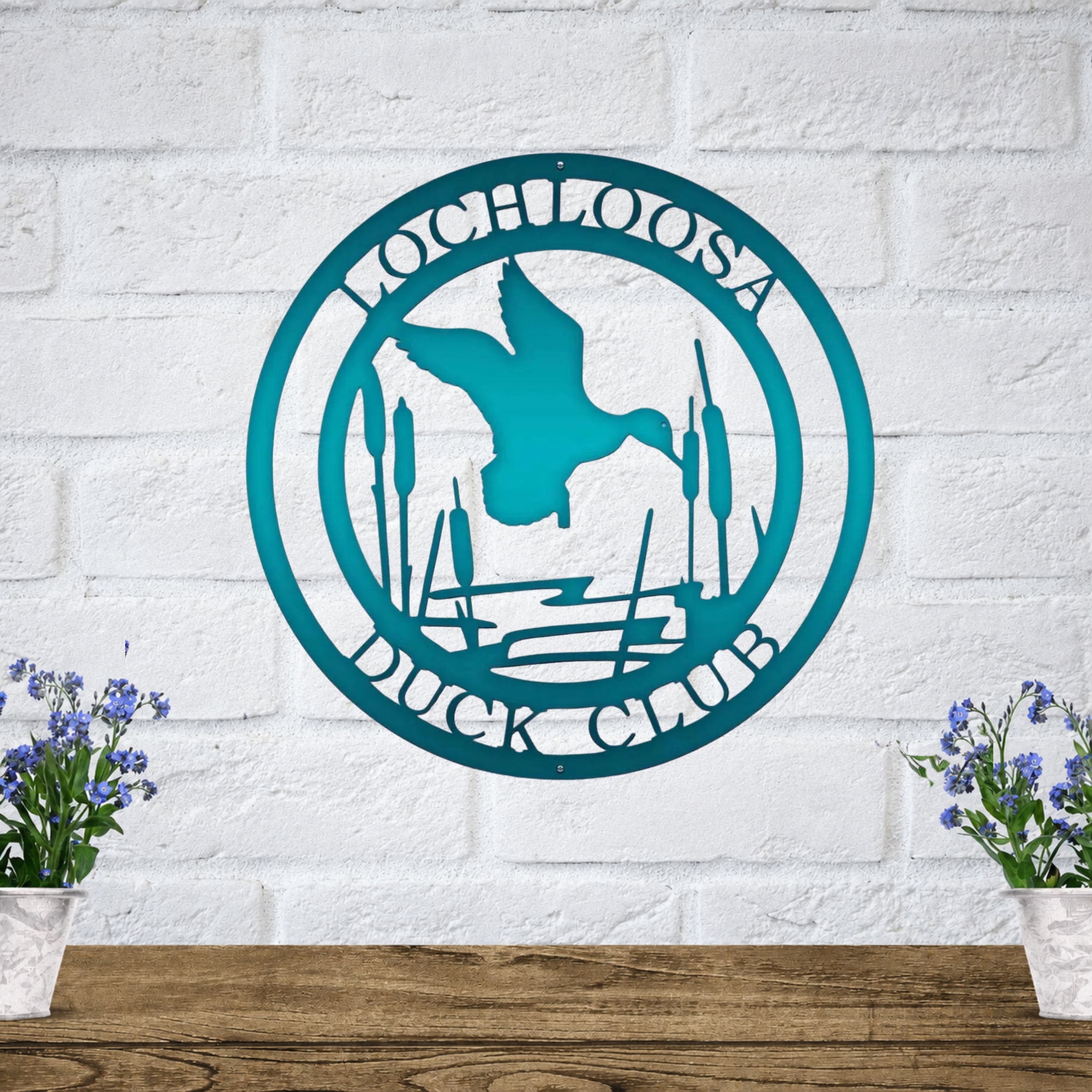 Teal personalized duck club metal wall art featuring duck and marsh scene for lake house, hunting lodge, or patio decor
