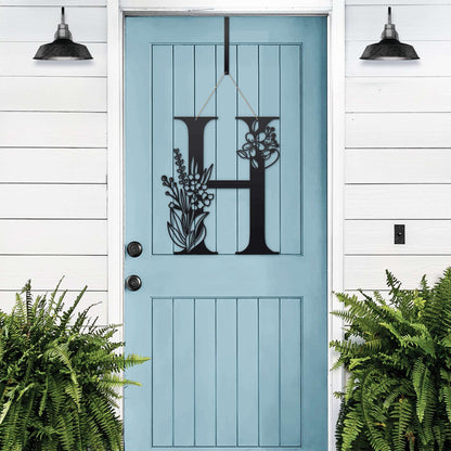 Custom Floral Monogram Wreath – black “H” metal letter with flower detail, ideal for farmhouse entry decor.