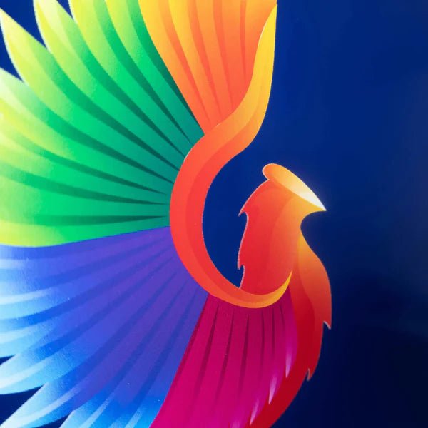 Colorful abstract metal artwork featuring a phoenix-like figure on a blue background, showcasing vibrant colors and dynamic design elements.
