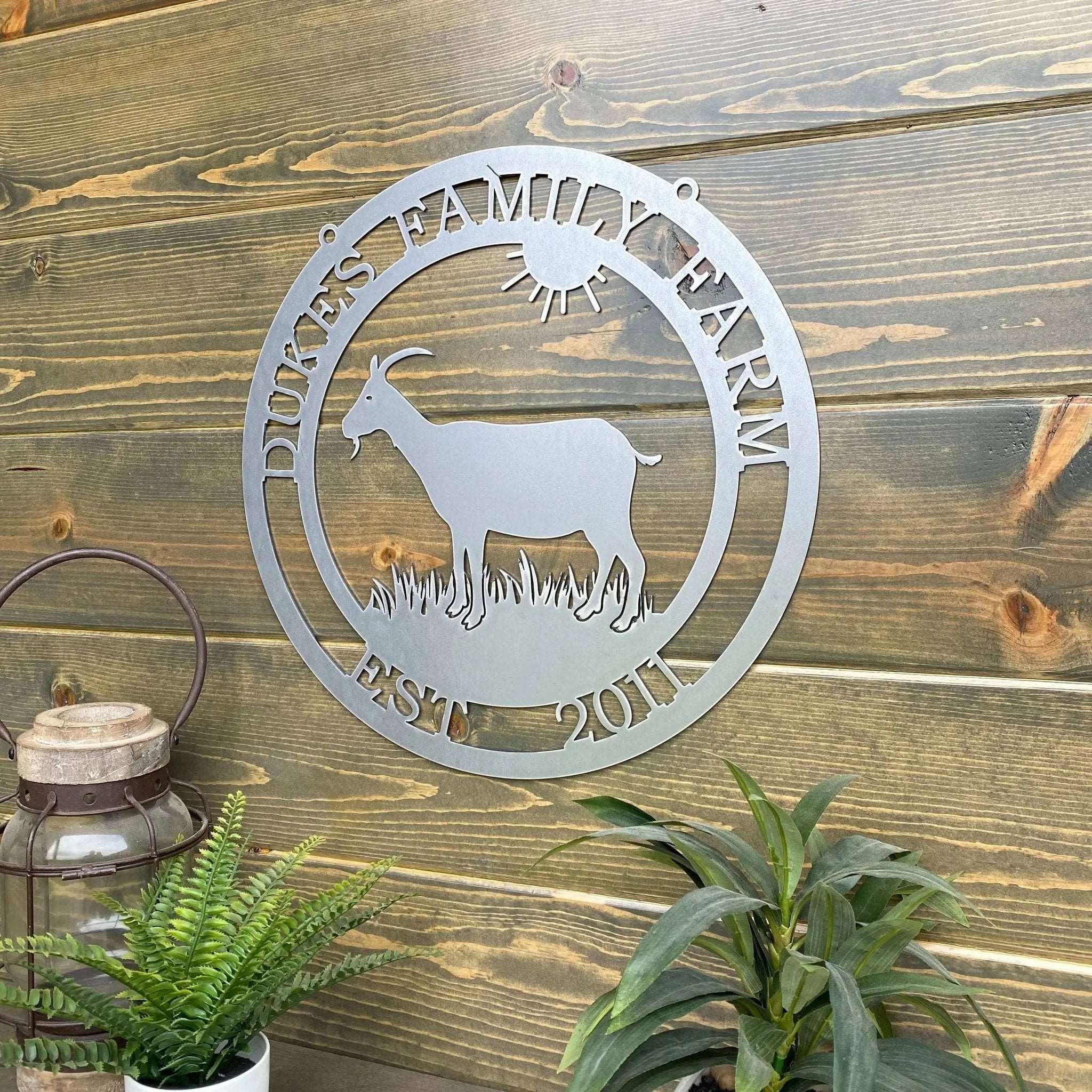 Custom goat metal sign for barns and farmhouses, outdoor décor with goat silhouette and 'Dukes Family Farm' text on wooden background