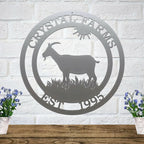 Custom gray goat metal sign for barns and farmhouses, outdoor décor with goat silhouette and 'Crystal Farms' text on white brick wall