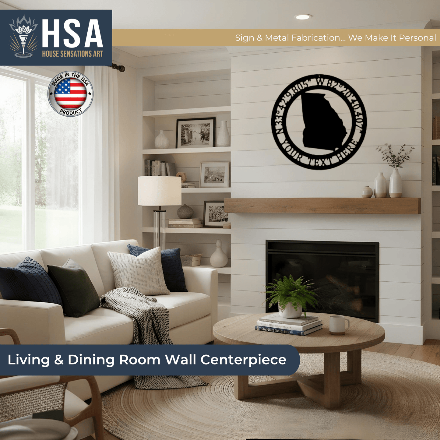 Living room with wall-mounted personalized metal GPS coordinates sign, featuring HSA House Sensations Art branding, decorative home wall décor