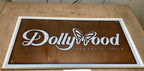 Custom laser-cut metal Dollywood Safety & Security sign, decorative outdoor plaque mounted on stone surface, powder coated for durability