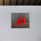 Red custom light box sign with “IA” logo and “Independence Aviation” text displayed on a gray wall