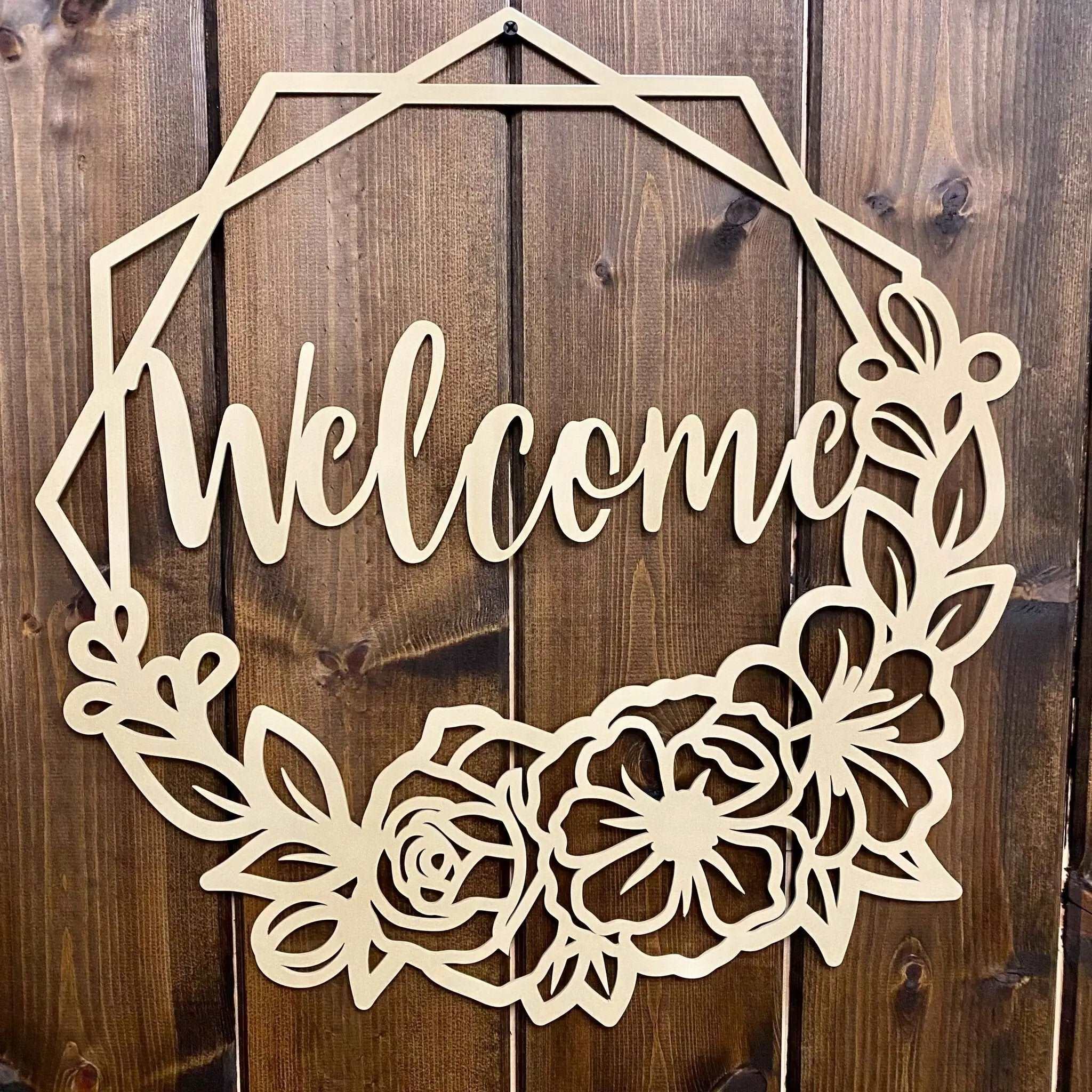 Decorative wooden “Welcome” sign with floral designs on wooden background, custom indoor or outdoor home décor accent