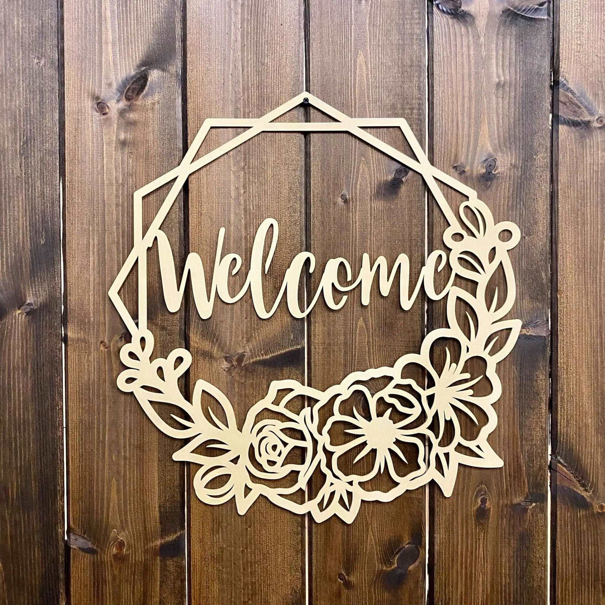 Decorative wooden “Welcome” sign with floral designs on wooden background, custom indoor or outdoor home décor accent