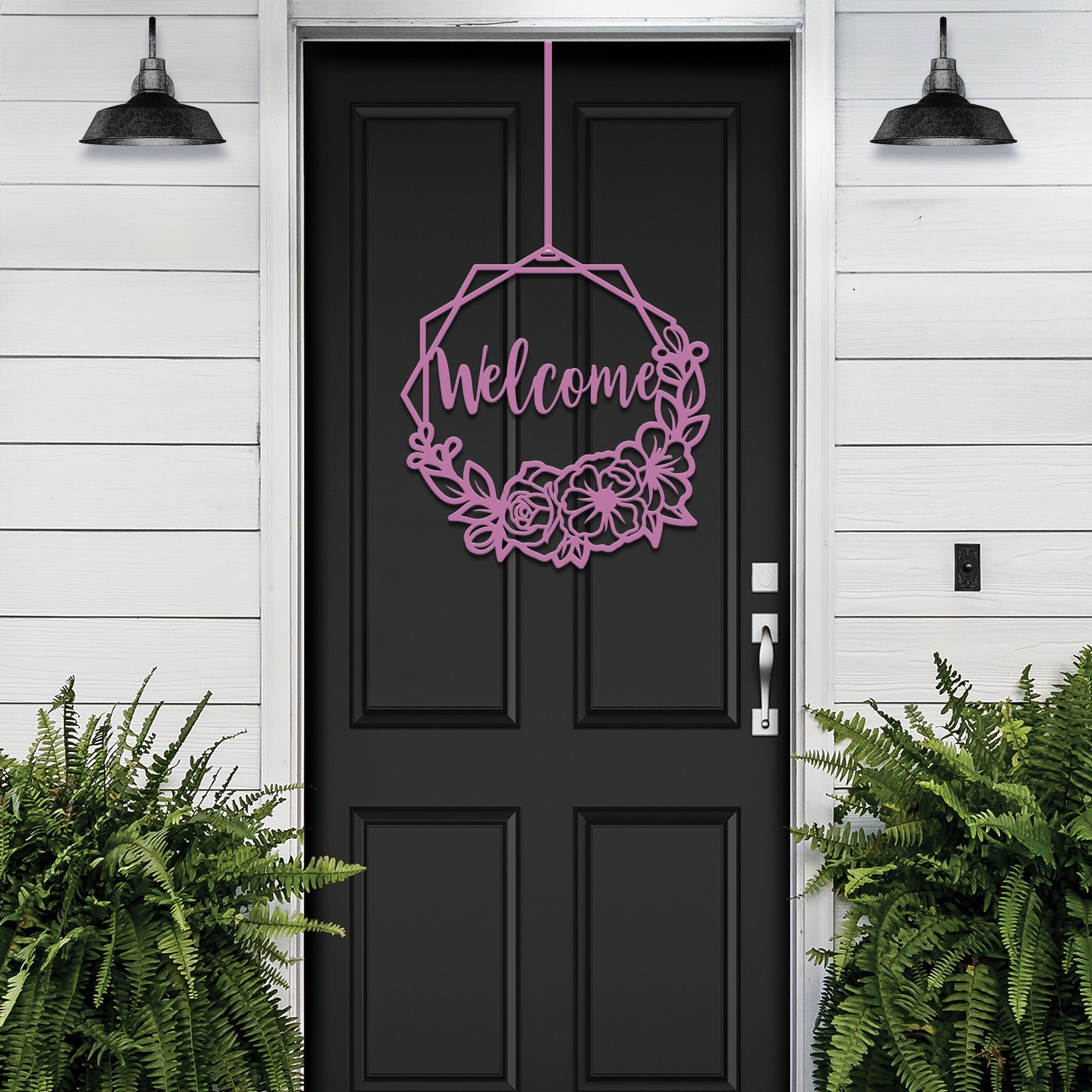 Decorative “Welcome” sign with floral design hanging on black door, custom outdoor home entrance décor