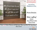 Decorative metal sign featuring engraved text, displayed on a wooden surface with plants, highlighting elegant design, rustic charm, and durable craftsmanship.