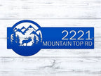 Blue metal custom moose address sign with mountain and deer design on white wooden background, rustic outdoor cabin decor