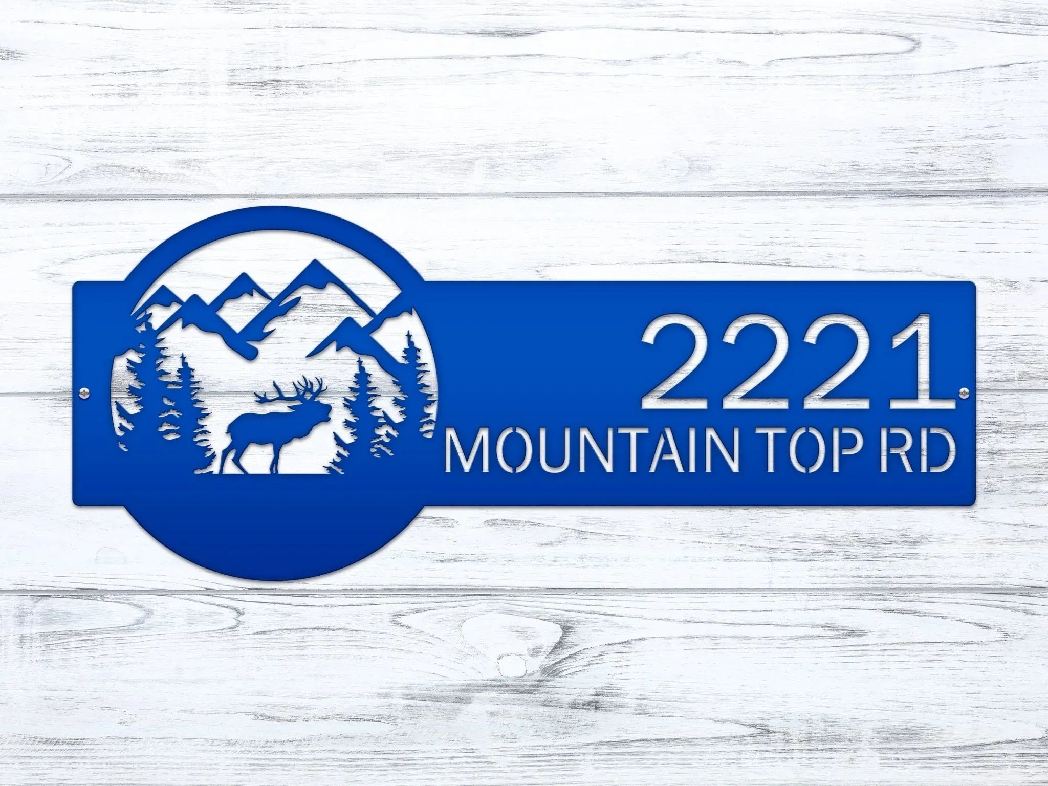 Blue metal custom moose address sign with mountain and deer design on white wooden background, rustic outdoor cabin decor