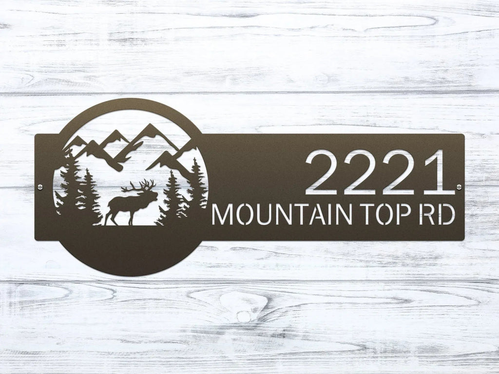 Decorative house number sign with moose and mountain design on wooden background, rustic outdoor cabin metal decor
