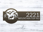 Decorative house number sign with moose and mountain design on wooden background, rustic outdoor cabin metal decor