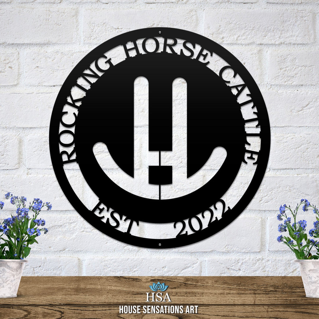 Custom personalized metal farm sign featuring “Rocking Horse Cattle” design, displayed on a white brick wall, perfect for rustic or modern farmhouse décor and custom property signage.
