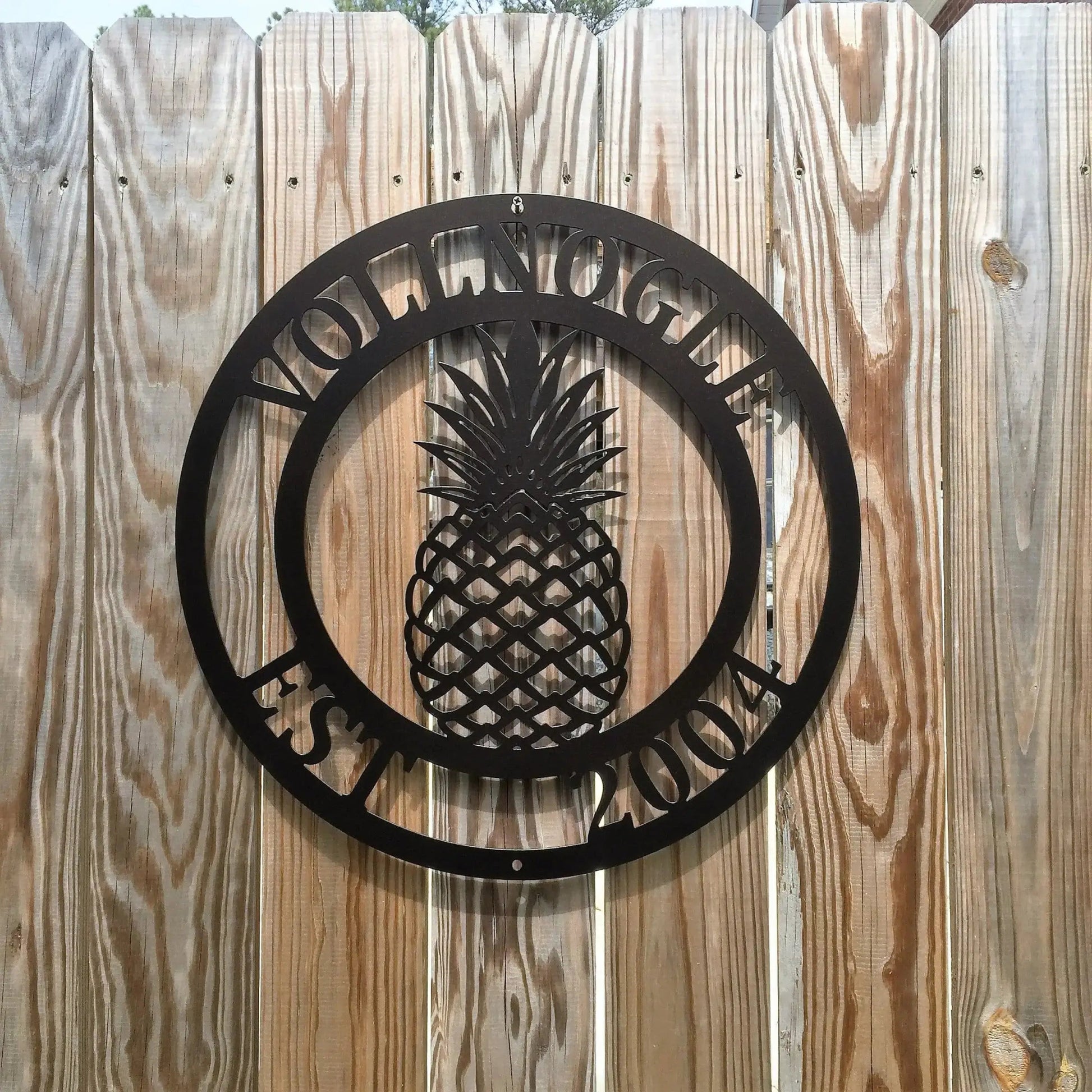 Custom Pineapple Address Sign in black – classic circular metal house sign with pineapple graphic and personalized address border.