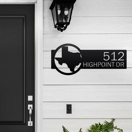 Black metal Custom State Address Sign with house number '512', street name 'Highpoint Dr.', and state logo on right, mounted on door wall.
