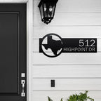 Personalized metal house number sign with Texas outline mounted on a white exterior wall for outdoor decor, HouseSensationsArt