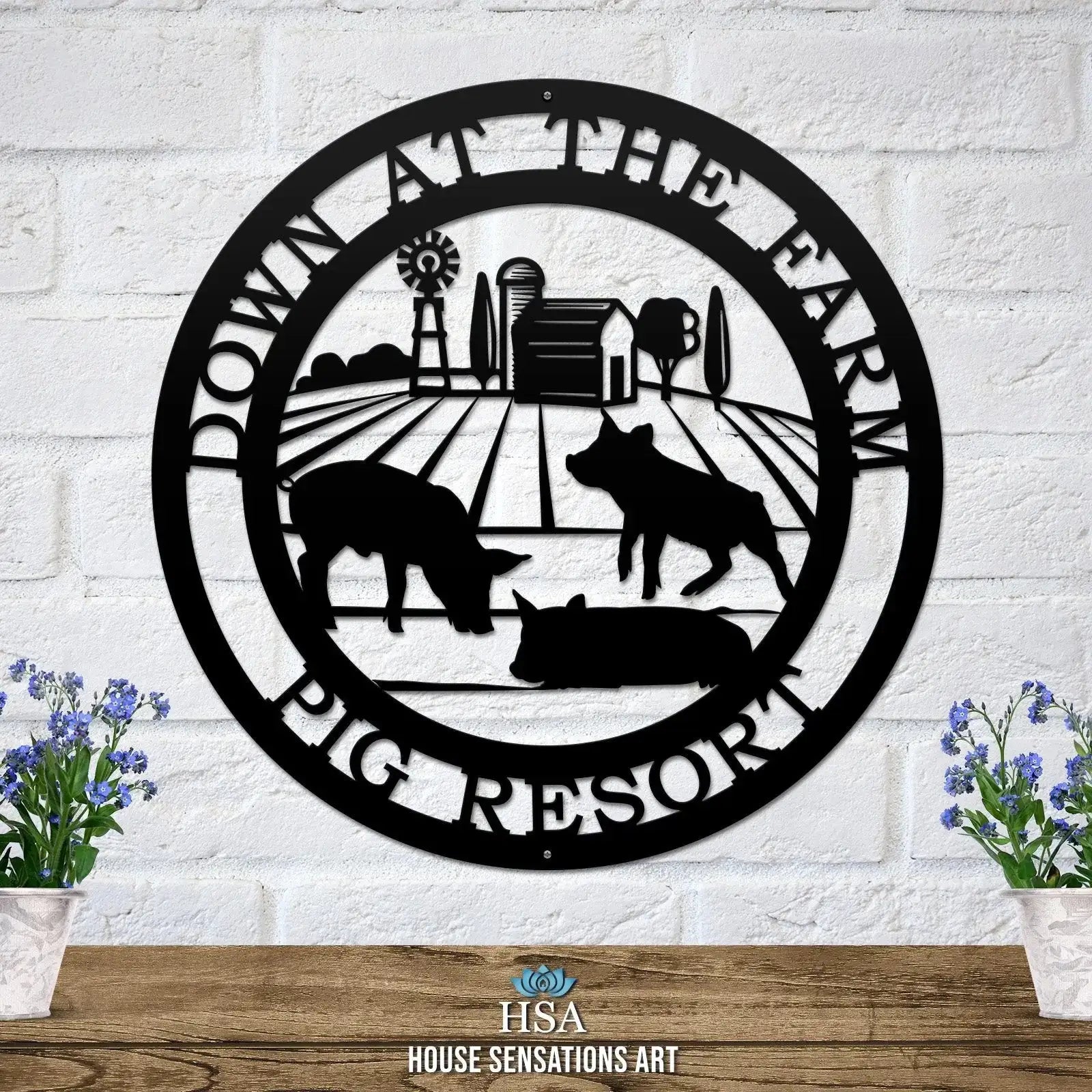 Decorative metal farm sign with pig scene and “Down at the Farm Pig Resort” text on white brick wall, front door outdoor plaque, rustic décor