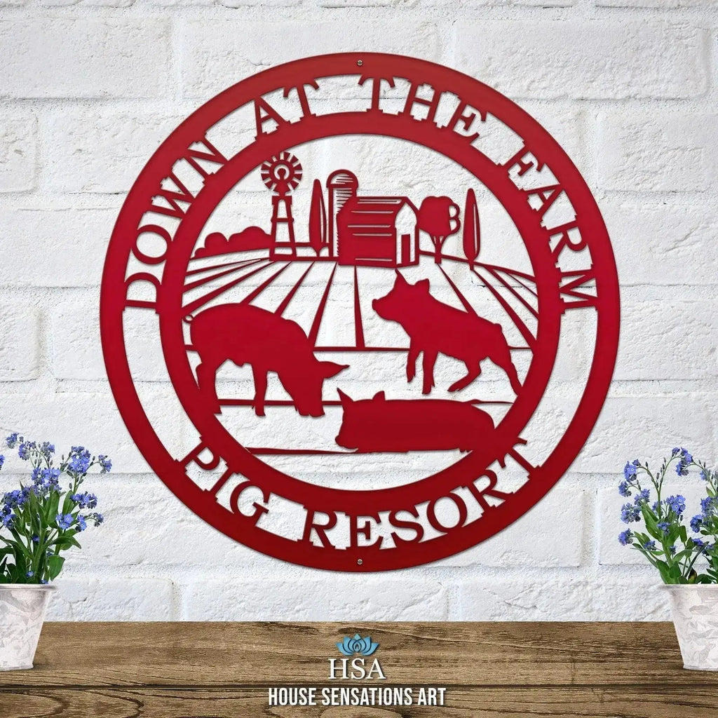 Decorative metal farm sign with pig scene and “Down at the Pig Farm Pig Resort” text on white brick wall, front door outdoor plaque, rustic décor