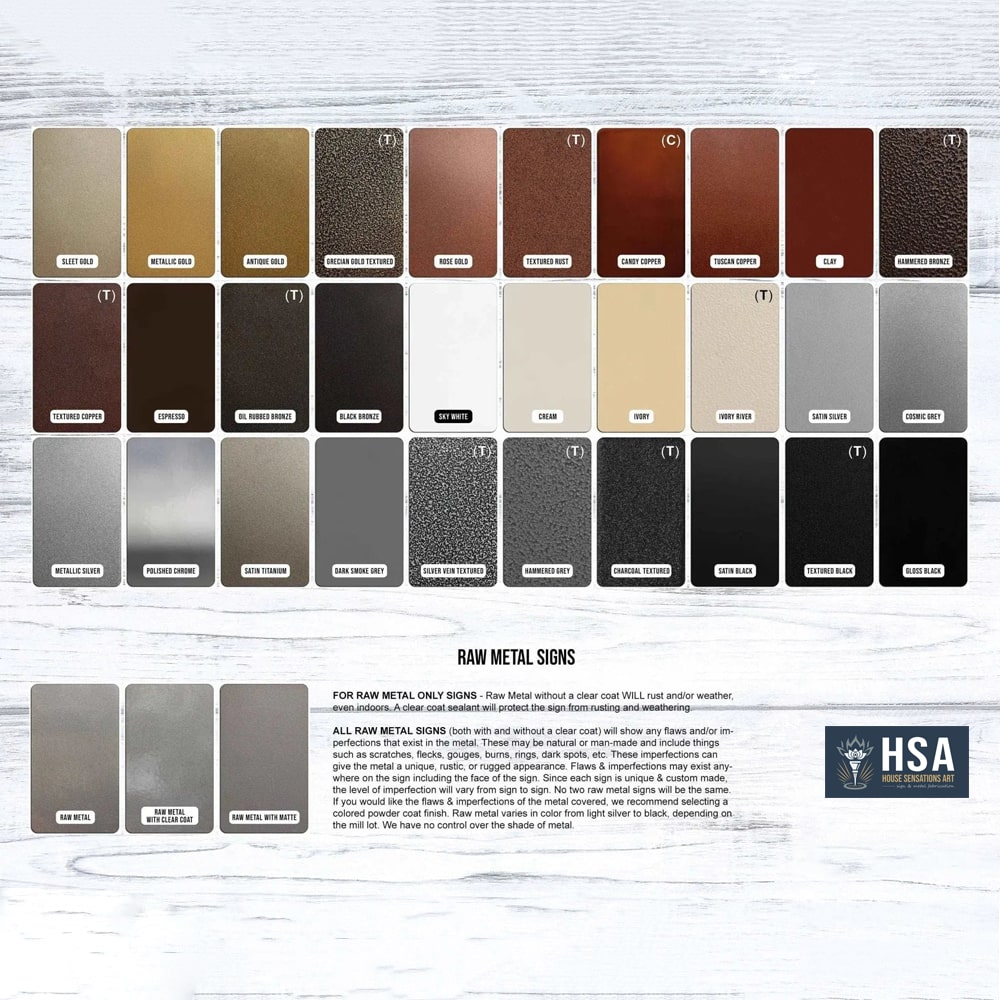 Color swatch chart showcasing raw metal signs with various metallic finishes arranged on a white wooden background, highlighting a range of silver, gold, bronze, and brushed metal tones.