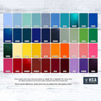 Color swatch chart displaying a variety of colors arranged on a light wooden background, showcasing a vibrant range of shades and finishes for design or decorative purposes.