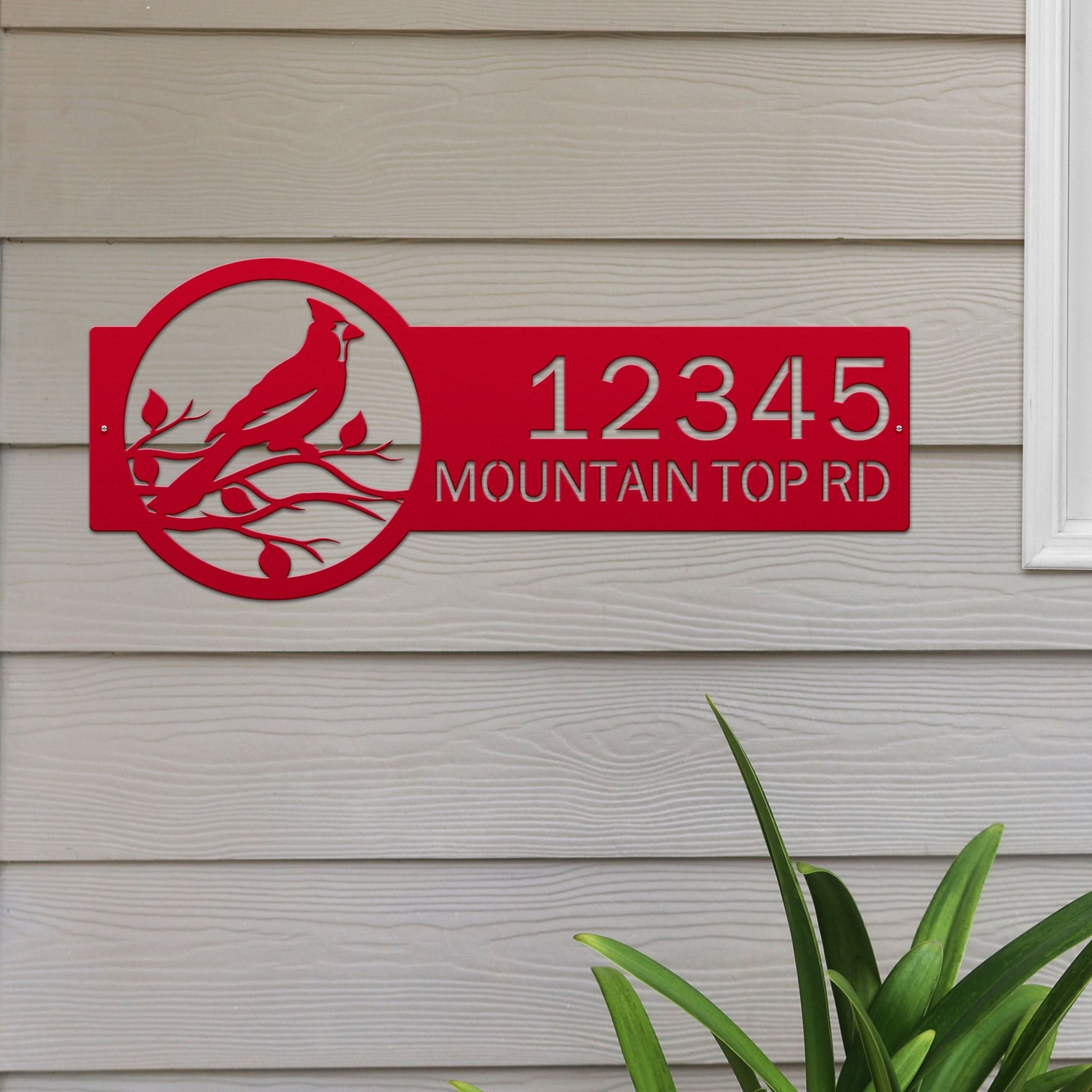 Deep red Custom Cardinal Address Sign with cardinal on leafy branch on right and house number '12345 Mountain Top Rd' on left.