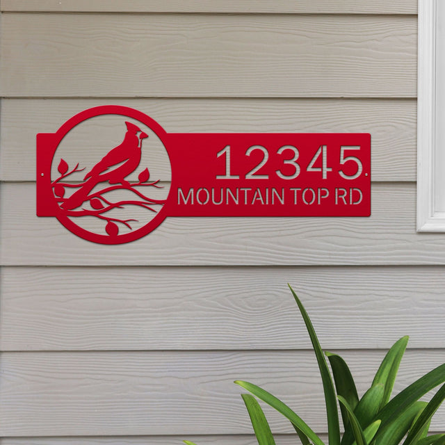 Deep red Custom Cardinal Address Sign with cardinal on leafy branch on right and house number '12345 Mountain Top Rd' on left.