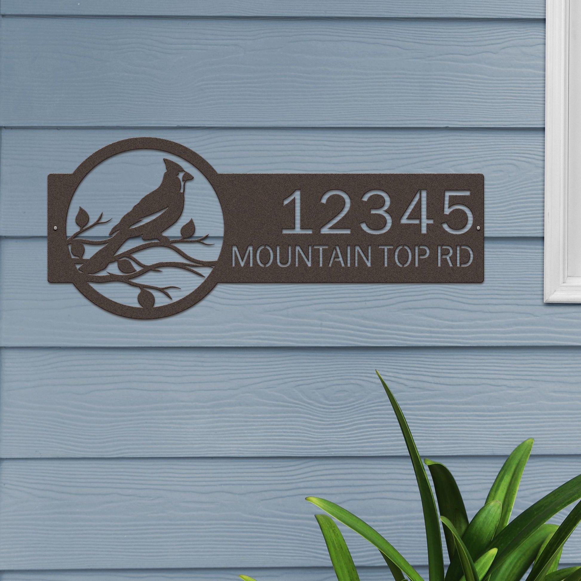 Oil rubbed bronze Custom Cardinal Address Sign with cardinal on leafy branch on right and house number '12345 Mountain Top Rd' on left.