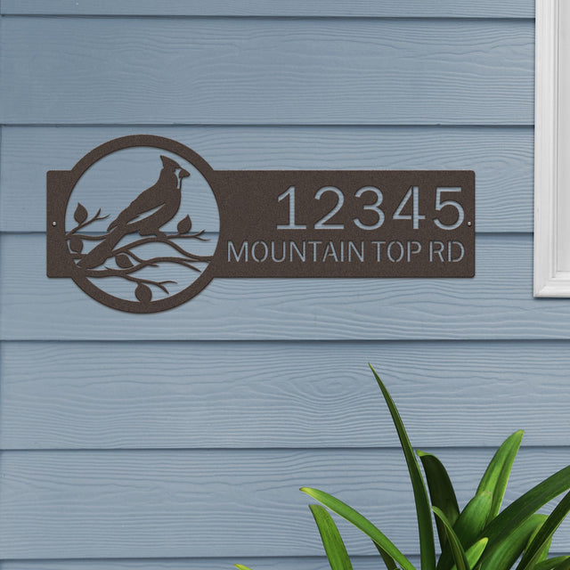 Oil rubbed bronze Custom Cardinal Address Sign with cardinal on leafy branch on right and house number '12345 Mountain Top Rd' on left.
