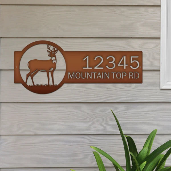 Bronze deer address sign with silhouette on right and '12345 Mountain Top Rd' in bold rustic text, designed for outdoor use.