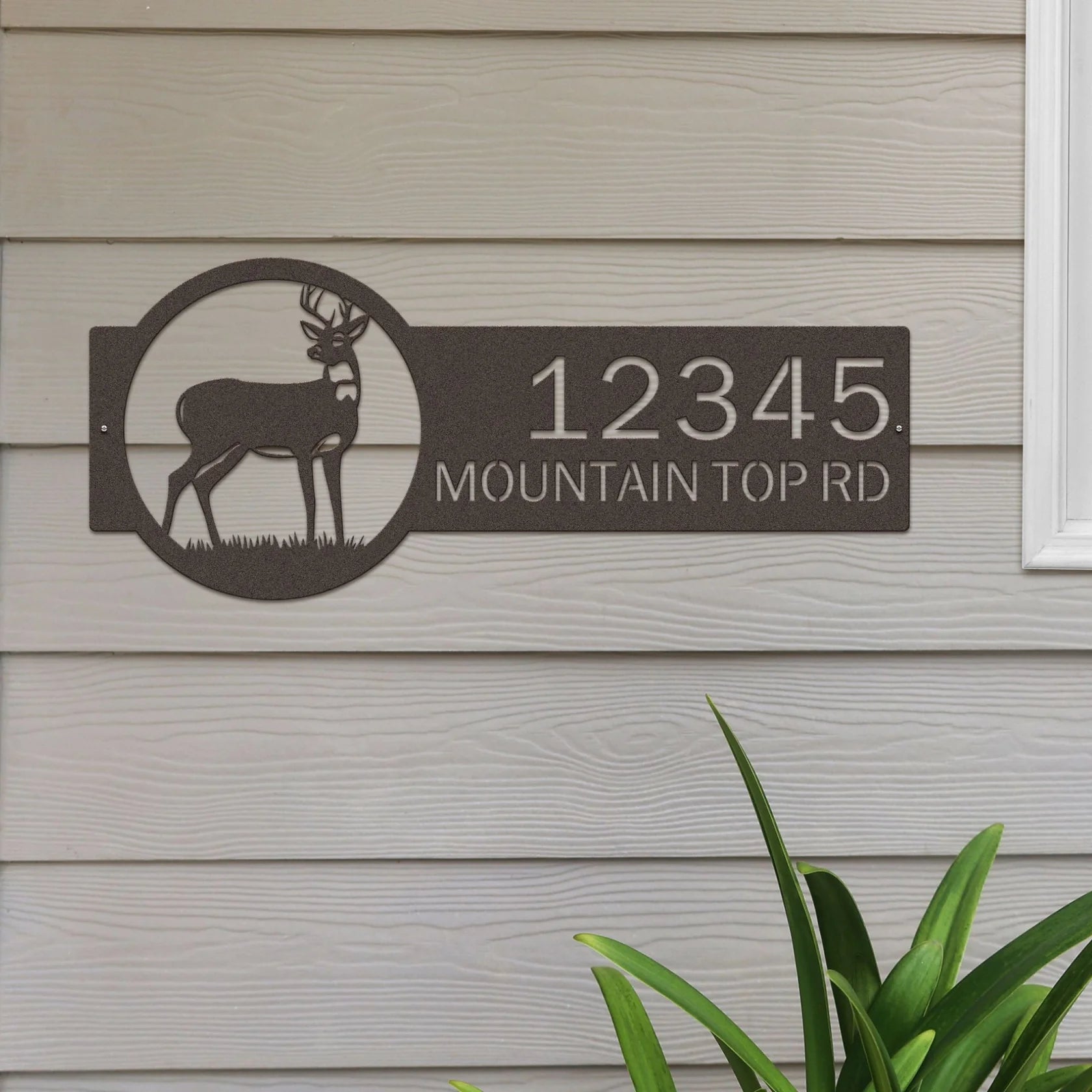 Textured Copper address sign with deer on right and '12345 Mountain Top Rd' in bold text on left, built for outdoor display.

