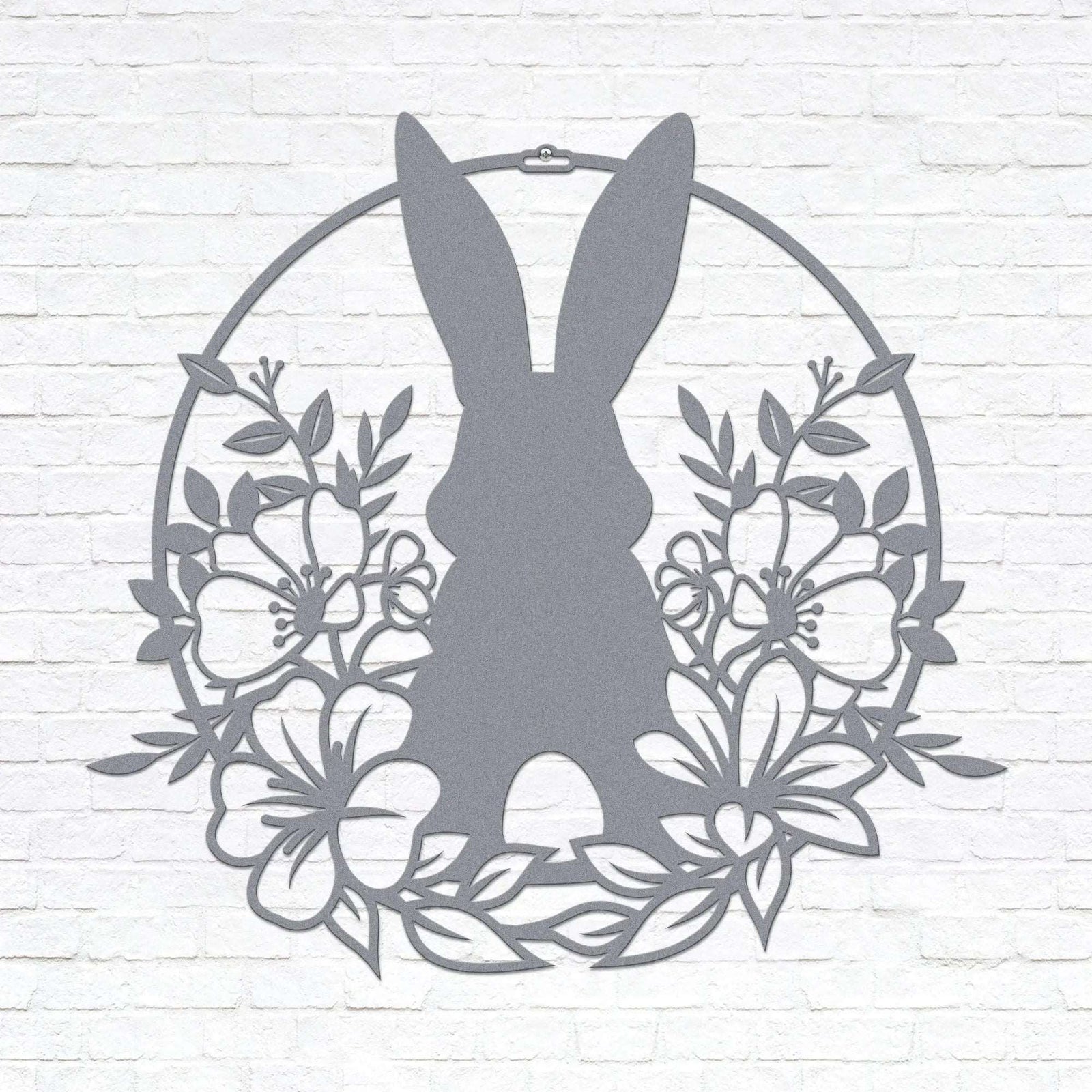Custom Easter bunny metal wall sign with floral wreath, powder coated outdoor spring décor, rabbit silhouette front door decoration, farmhouse-style Easter wall art on white brick background, pastel seasonal accent