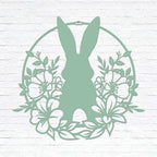 Custom Easter bunny metal wall sign with floral wreath, powder coated outdoor spring décor, rabbit silhouette front door decoration, farmhouse-style Easter wall art on white brick background