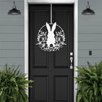 White Easter bunny metal door sign with floral wreath, custom rabbit silhouette front door décor, powder coated outdoor spring decoration, farmhouse-style Easter porch sign with greenery on black door and gray siding