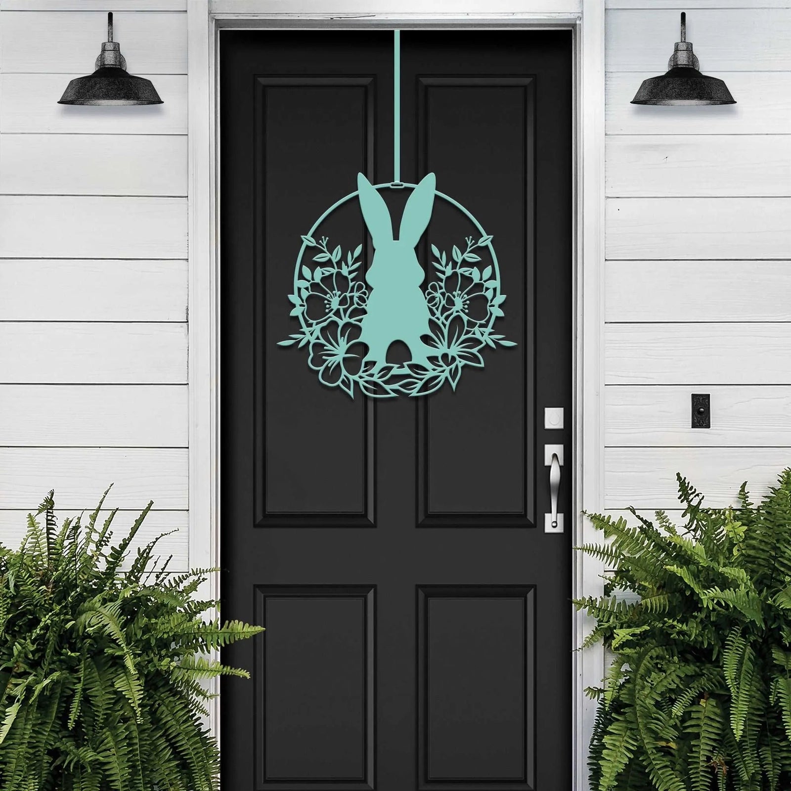 Matte black Easter bunny metal door sign, custom rabbit silhouette wall decor for front door, powder coated outdoor metal sign, modern spring porch décor with plants, minimalist farmhouse Easter decoration on black door