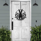 Matte black Easter bunny metal door sign, custom rabbit silhouette front door décor, powder coated outdoor spring decoration with greenery, farmhouse-style Easter porch sign on wooden door