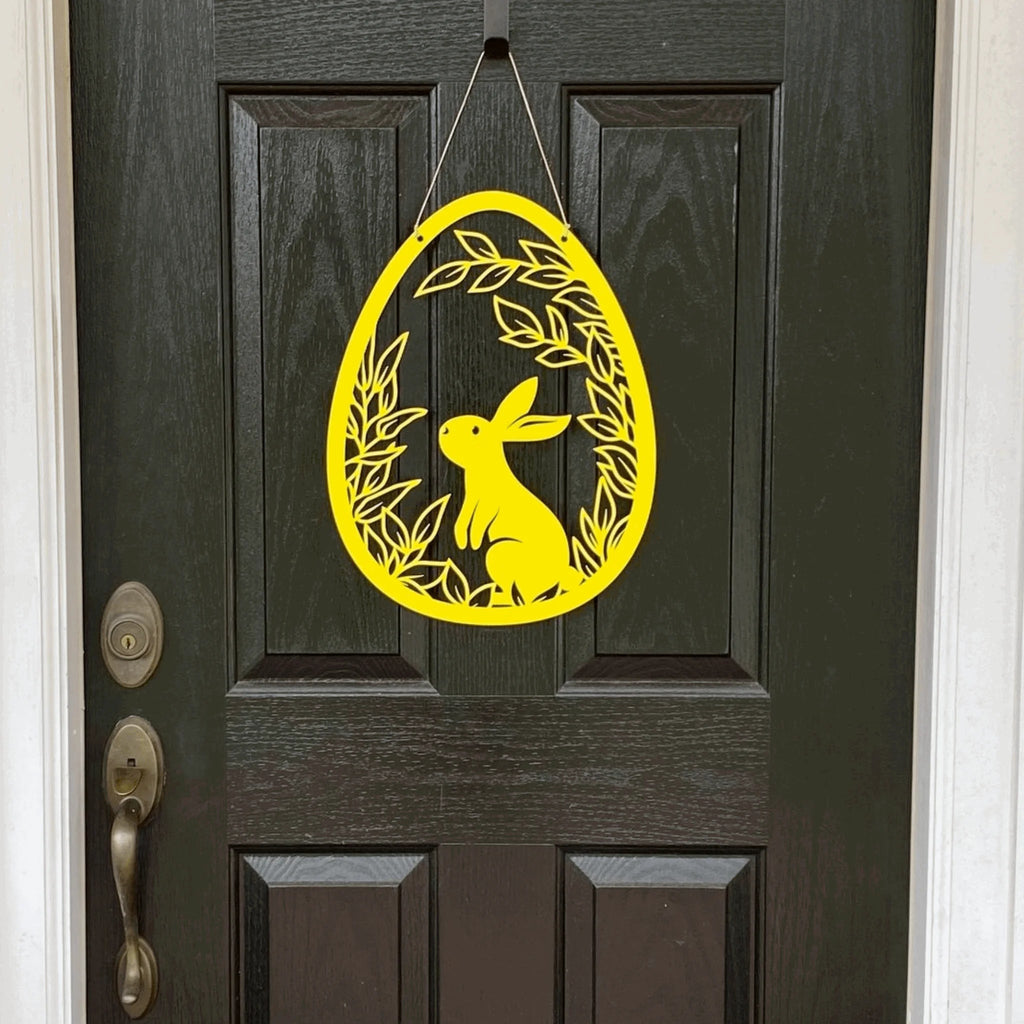 Yellow Easter bunny door hanger on dark wooden door, custom outdoor metal Easter décor, powder coated spring front door sign, farmhouse holiday decoration
