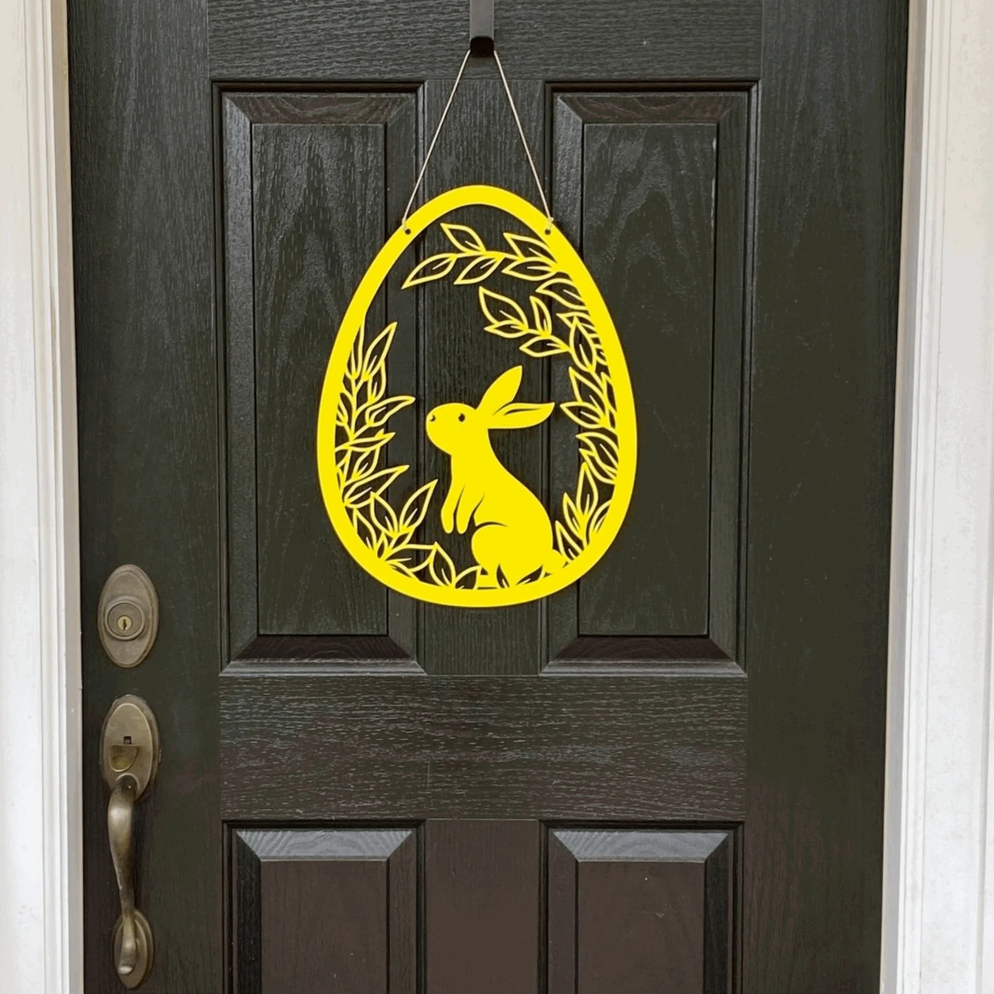 Yellow Easter bunny door hanger on dark wooden door, custom outdoor metal Easter décor, powder coated spring front door sign, farmhouse holiday decoration